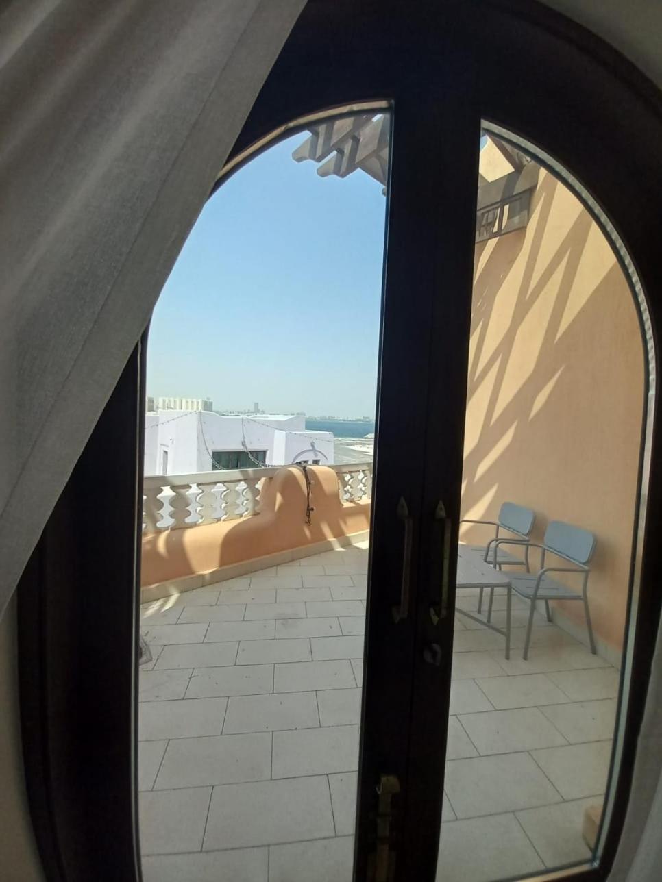 Mina Hotel And Residences By The Torch Доха Екстер'єр фото A view from the balcony of a suite at the hotel